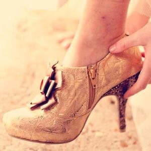Gold “Marie Antionette” inspired heels.